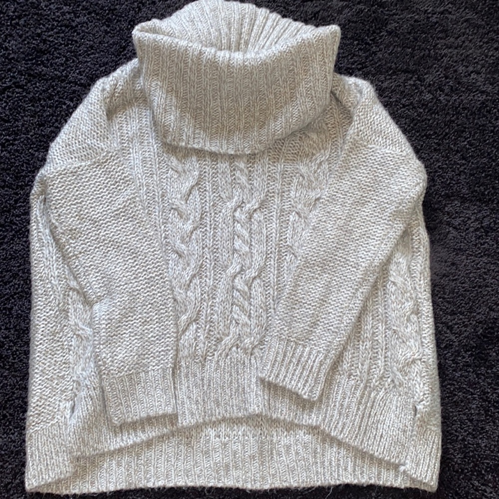 Jennifer Lopez large turtle neck sweater